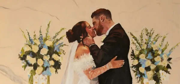 Oil painting of a bride and groom kissing between blue and white floral arrangements, by McKenzie The Wedding Painter