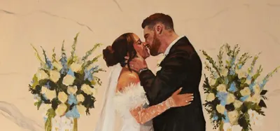 Oil painting of a bride and groom kissing between blue and white floral arrangements, by McKenzie The Wedding Painter