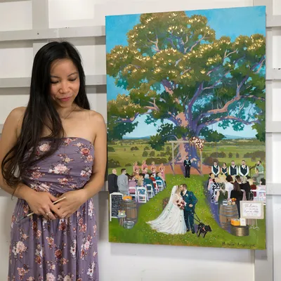 Artist beside her acrylic painting of a ceremony under a fig tree at Ben Ean, Hunter Valley, by Michelle Angelique Art