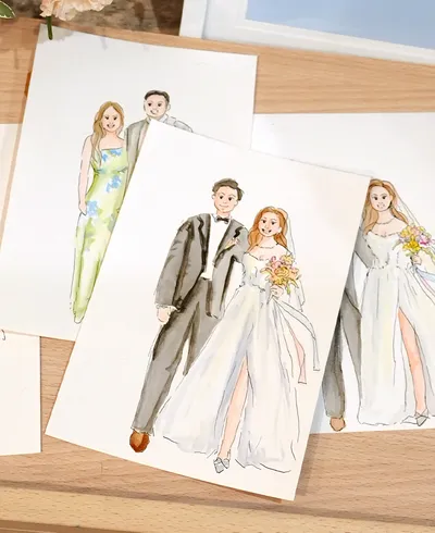 Watercolour and ink live wedding portraits of a bride and groom and a guest couple on cards, by Sik The Artist